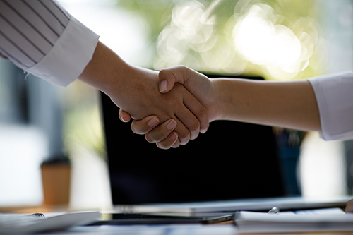 Business handshake for teamwork of business merger and acquisiti